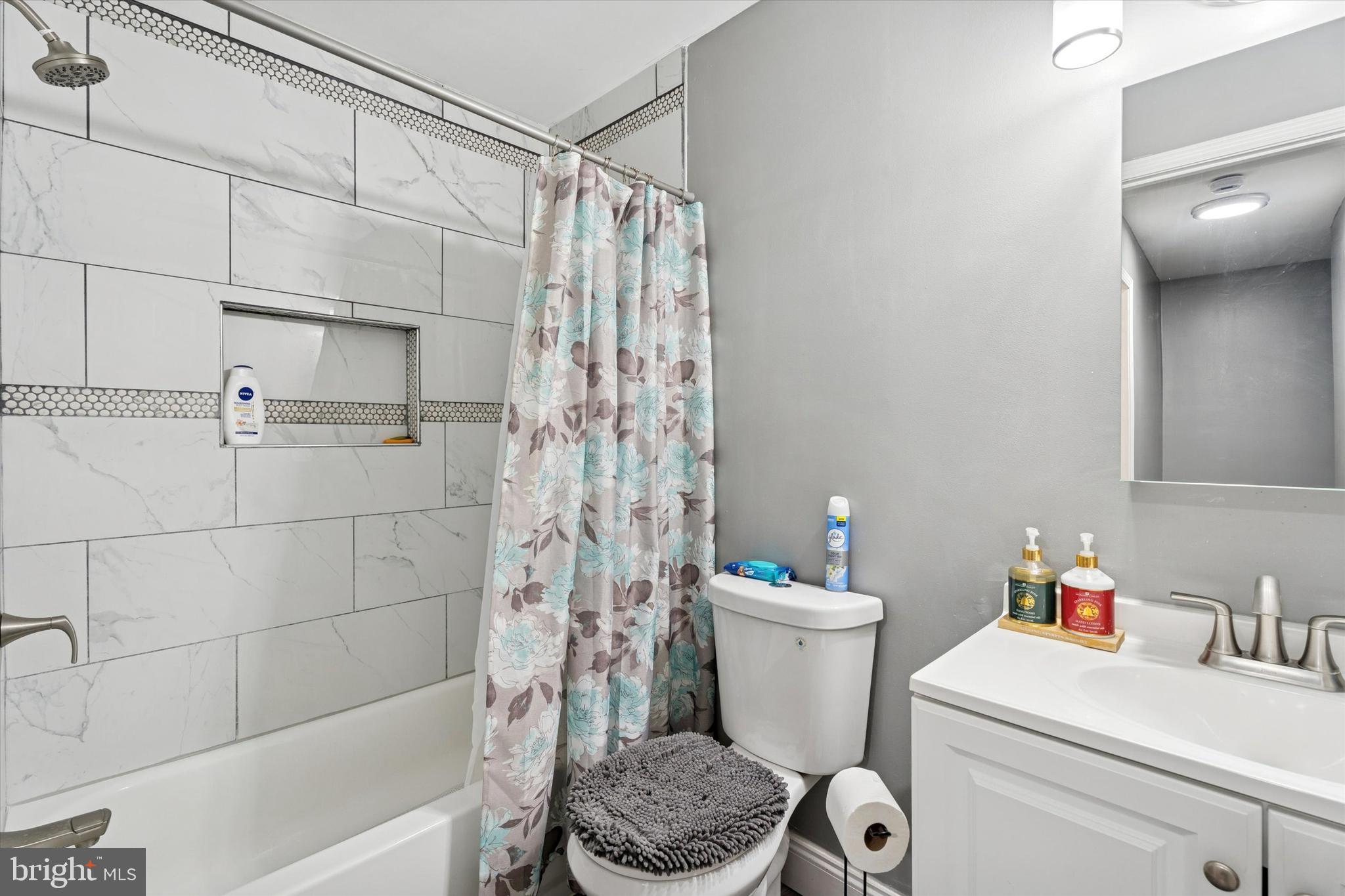 8319 Woolston Avenue Philadelphia, PA 19150 - Photo 16 of 30 a bathroom with a sink toilet and shower