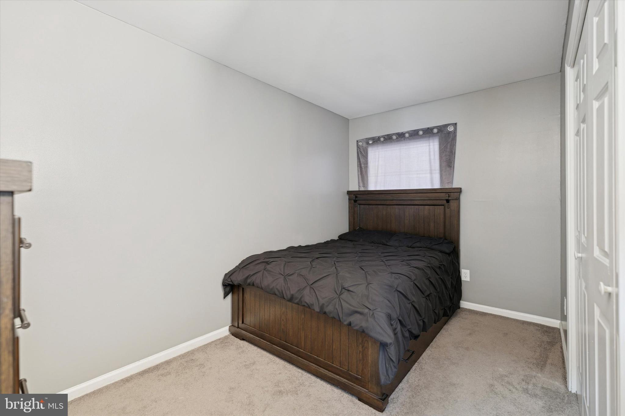 8319 Woolston Avenue Philadelphia, PA 19150 - Photo 19 of 30 a room with a bed and window
