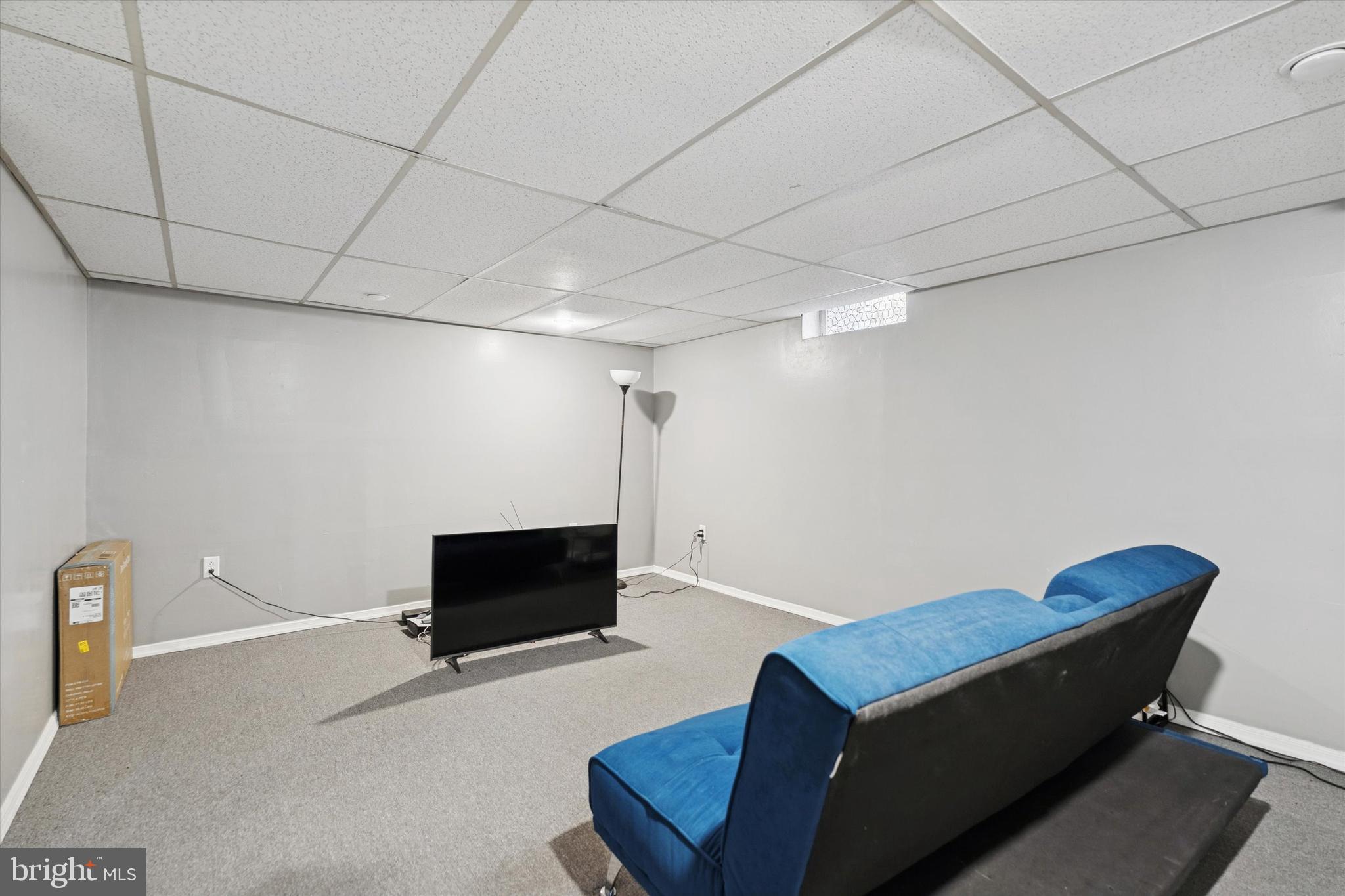 8319 Woolston Avenue Philadelphia, PA 19150 - Photo 23 of 30 a living room with furniture and a flat screen tv