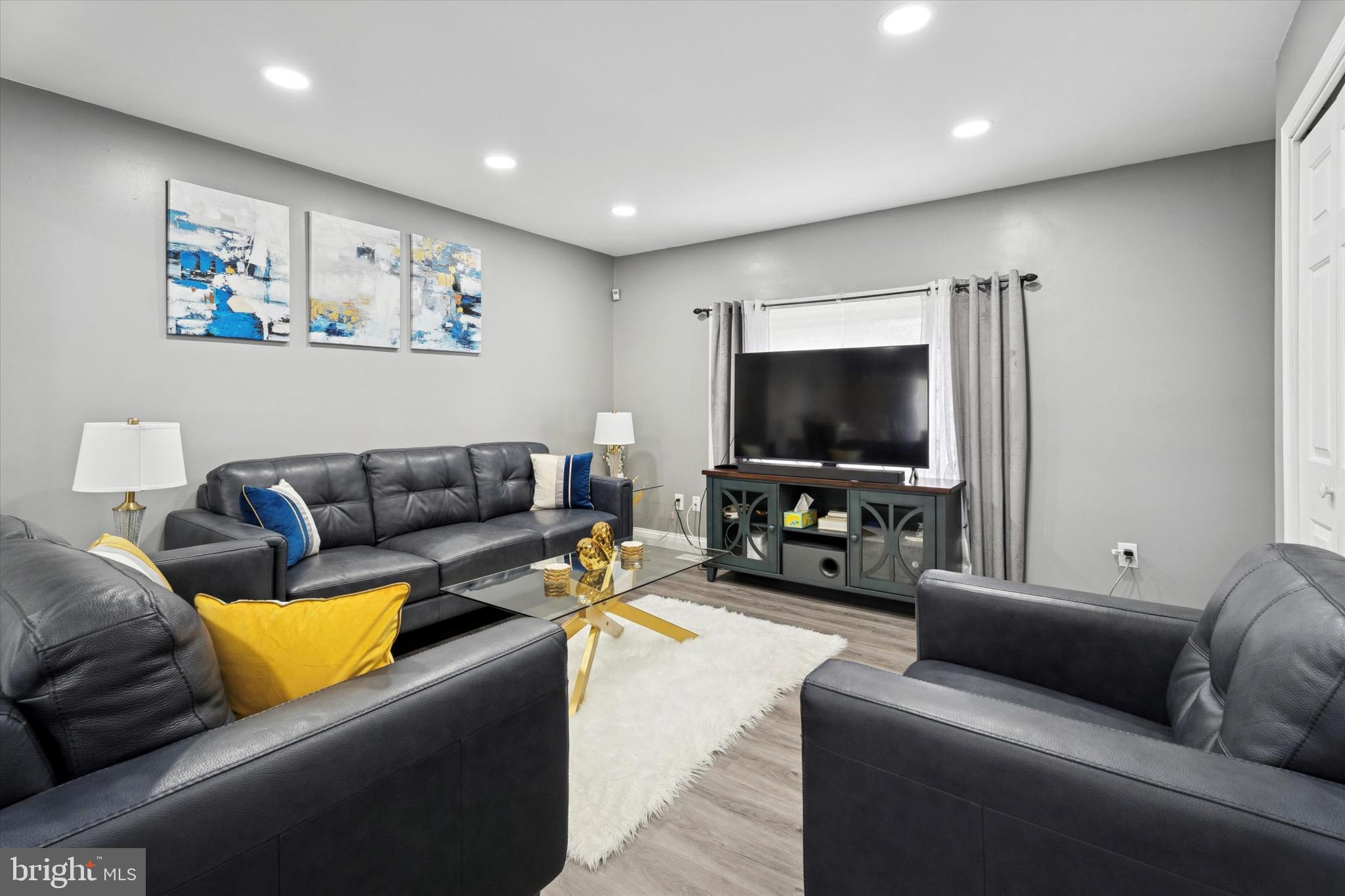 8319 Woolston Avenue Philadelphia, PA 19150 - Photo 8 of 30 a living room with furniture and a flat screen tv