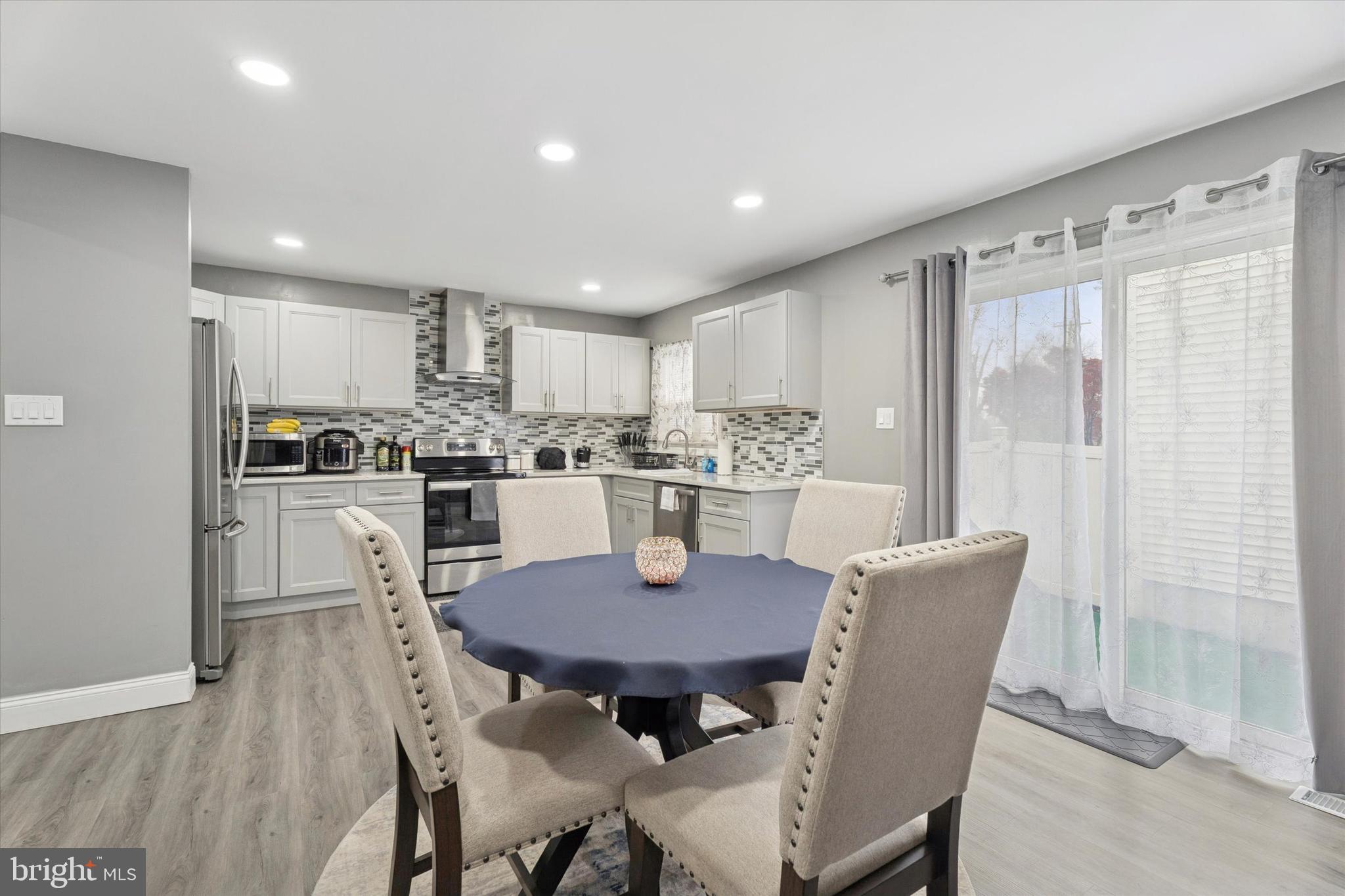 8319 Woolston Avenue Philadelphia, PA 19150 - Photo 9 of 30 a dining room with furniture and window