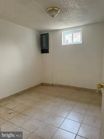 a view of an empty room with windows