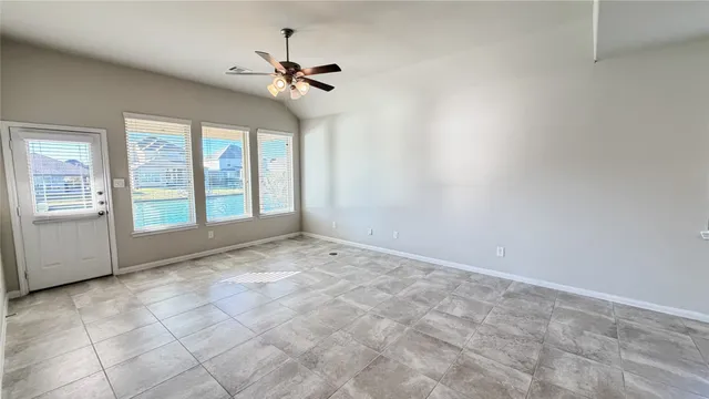 a view of an empty room with a window