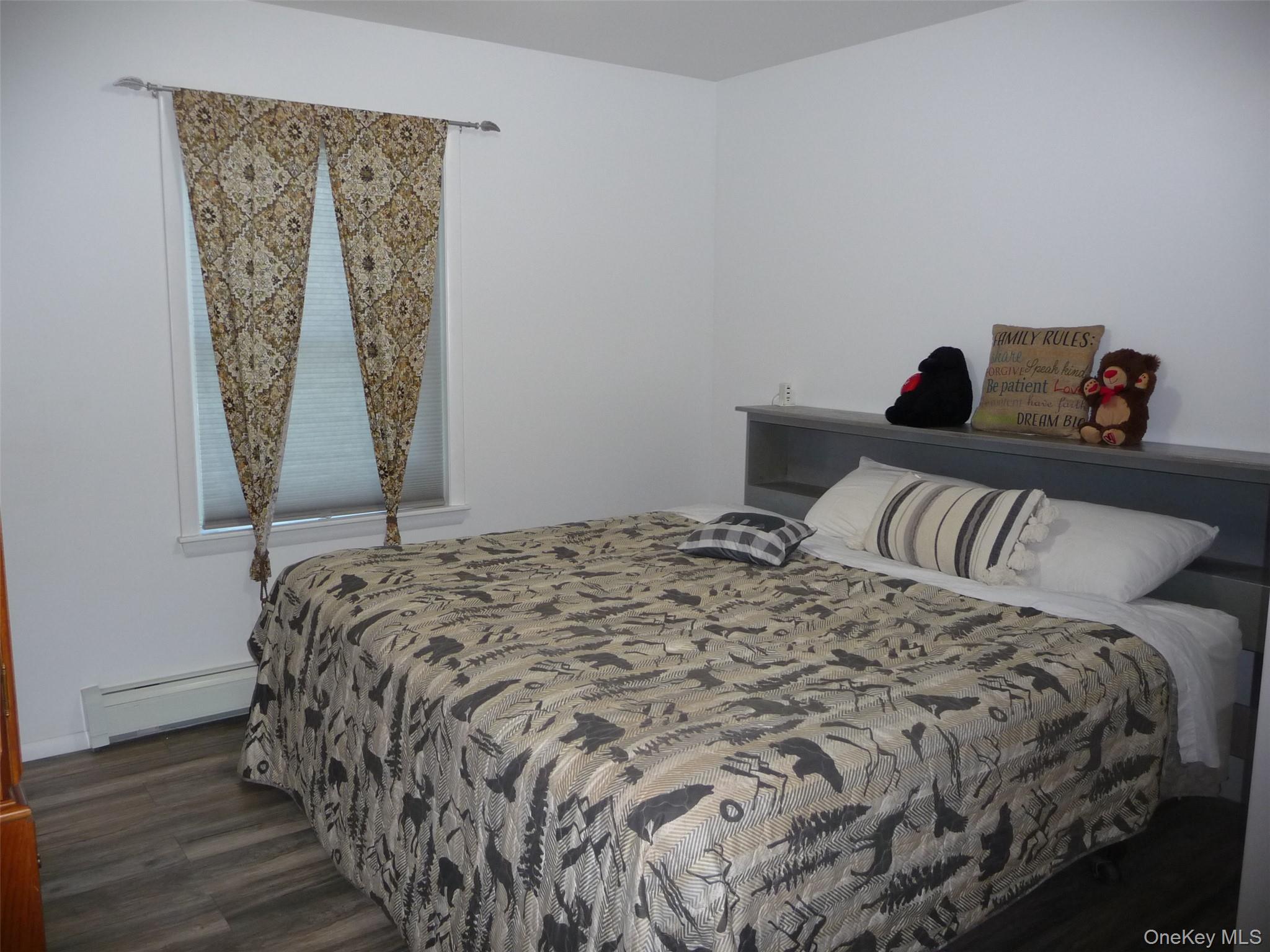 173 Franke Road Huguenot, NY 12746 - Photo 12 of 39 a bedroom with a bed and a window