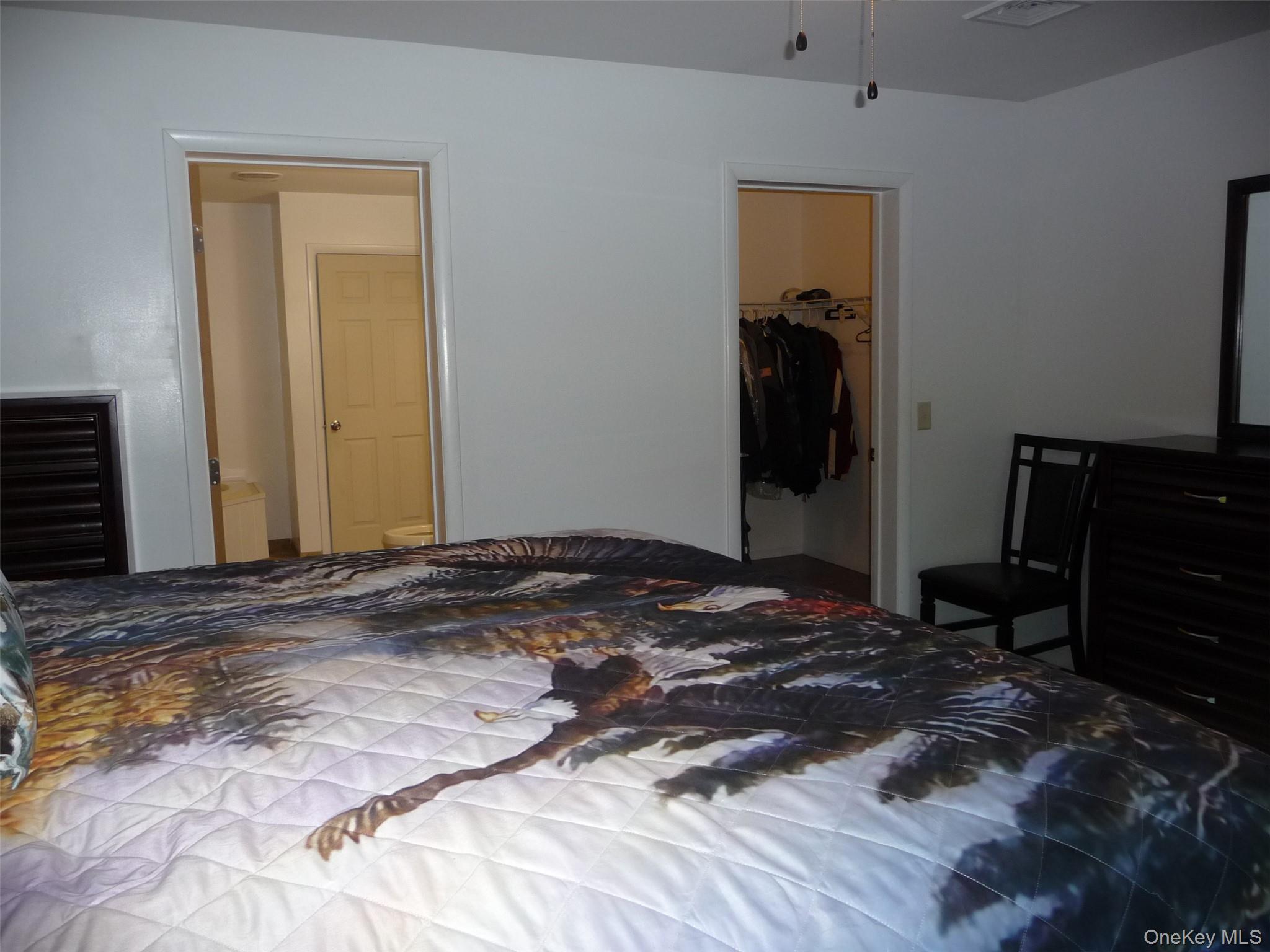 173 Franke Road Huguenot, NY 12746 - Photo 16 of 39 a bedroom with a bed and wooden floor