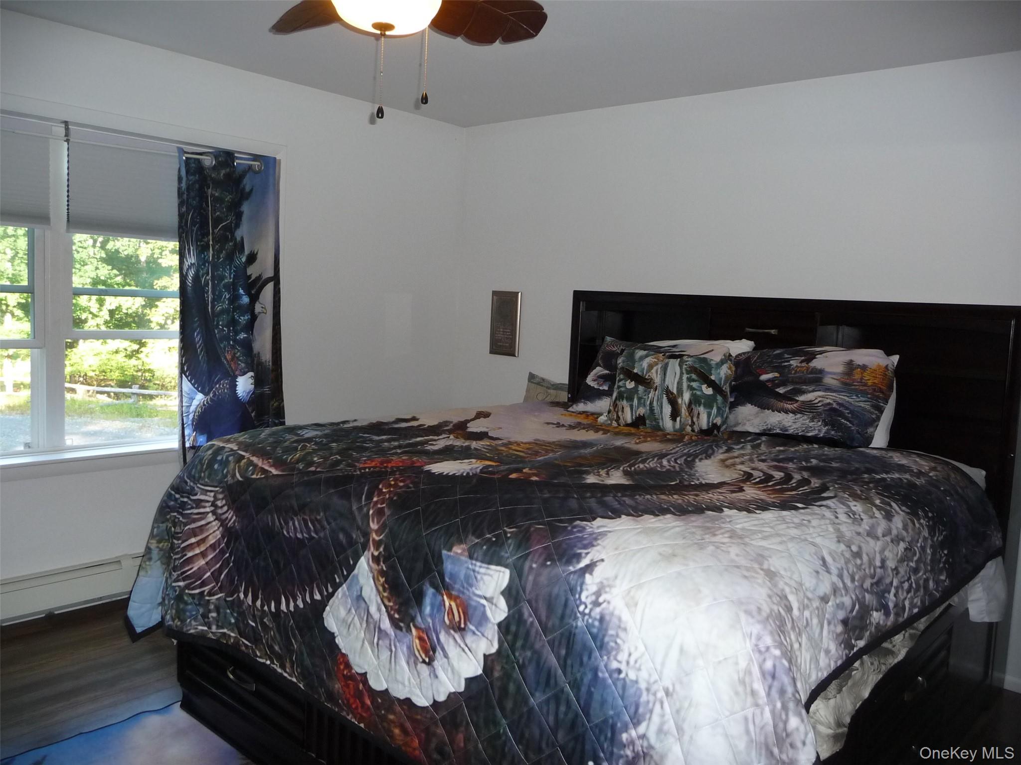 173 Franke Road Huguenot, NY 12746 - Photo 19 of 39 a bedroom with a bed and window