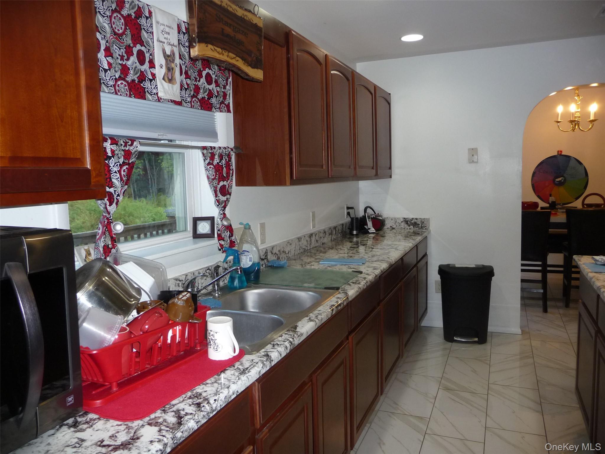 173 Franke Road Huguenot, NY 12746 - Photo 22 of 39 a kitchen with a sink stove and cabinets