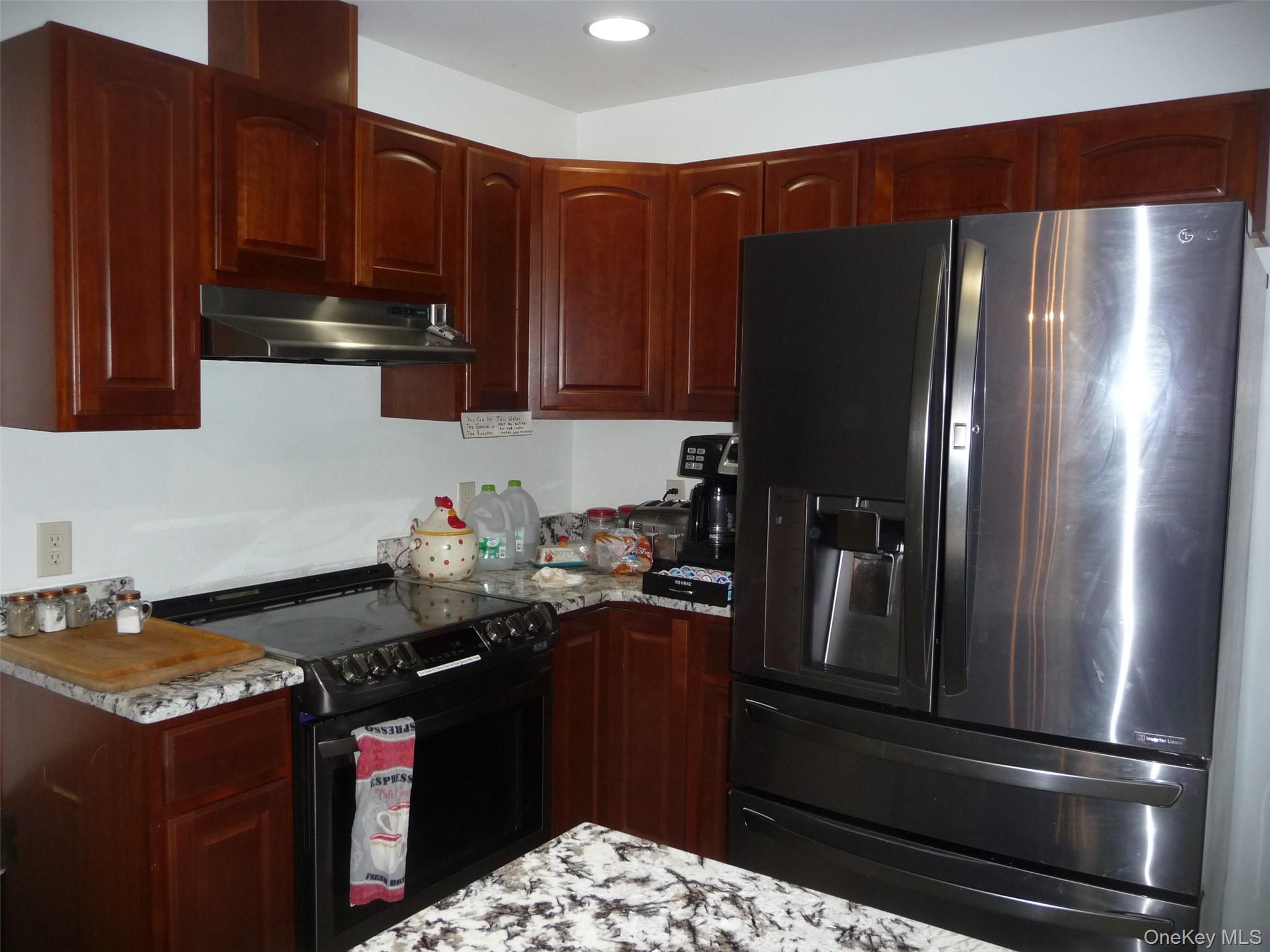 173 Franke Road Huguenot, NY 12746 - Photo 28 of 39 a kitchen with a refrigerator and a sink
