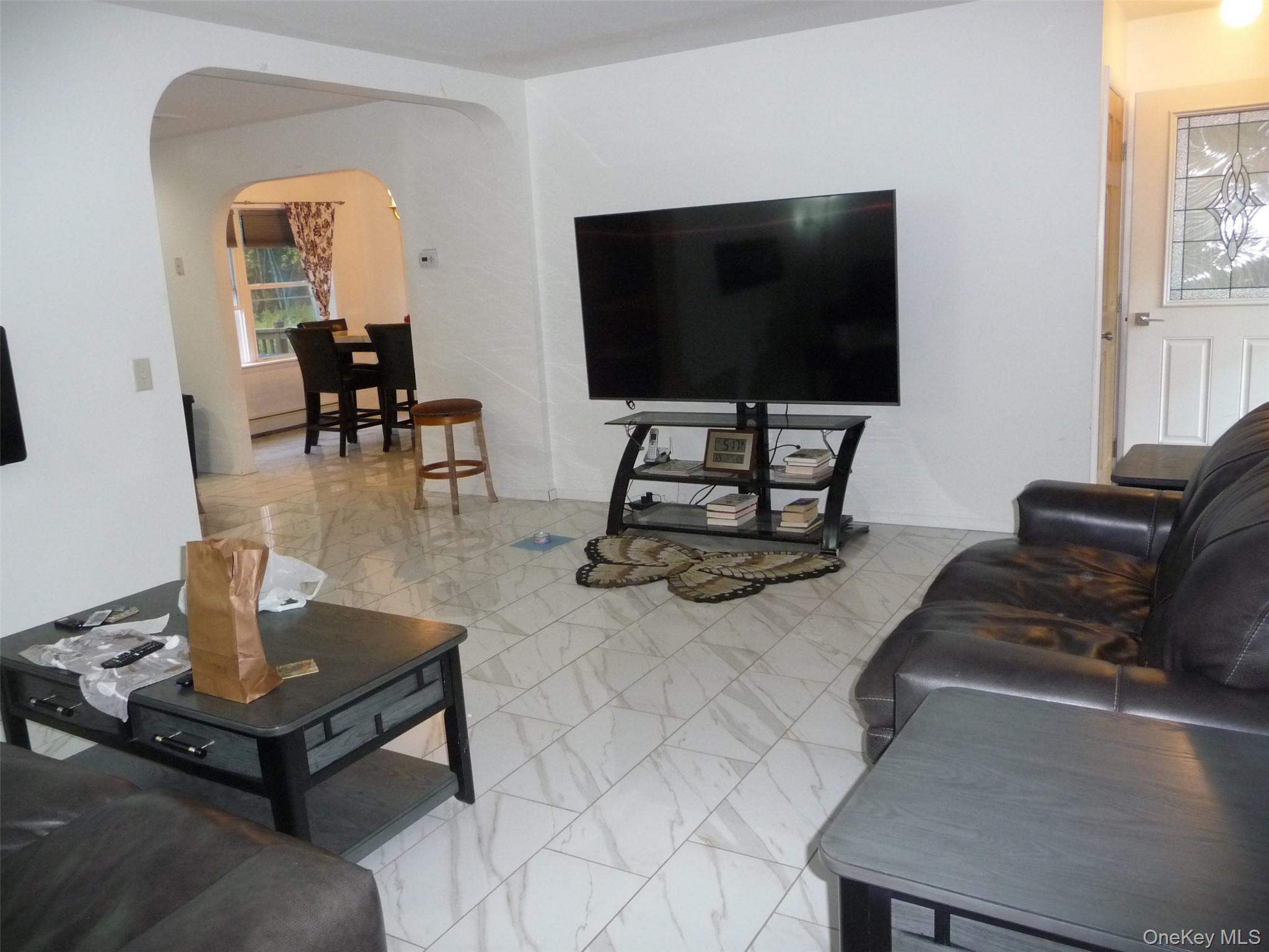 173 Franke Road Huguenot, NY 12746 - Photo 6 of 39 a living room with furniture and a flat screen tv