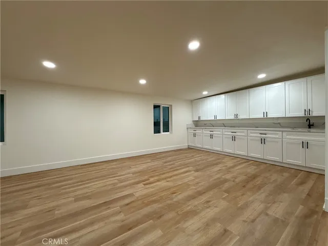 a bathroom with a toilet a sink and shower