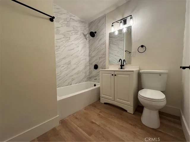 a kitchen with kitchen island a sink dishwasher stove and refrigerator
