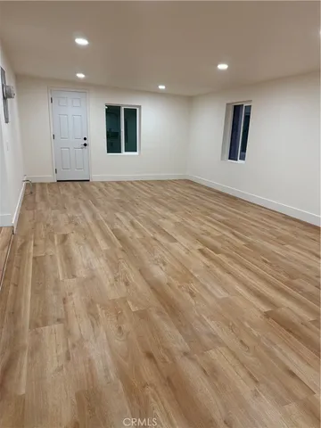 a view of kitchen with wooden floor