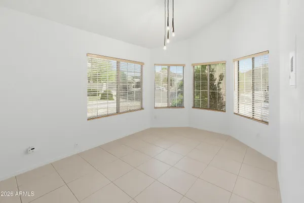 an empty room with a empty space and a ceiling fan