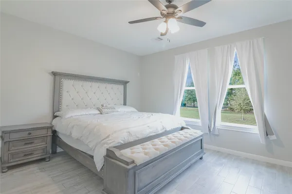 a bedroom with a bed and window