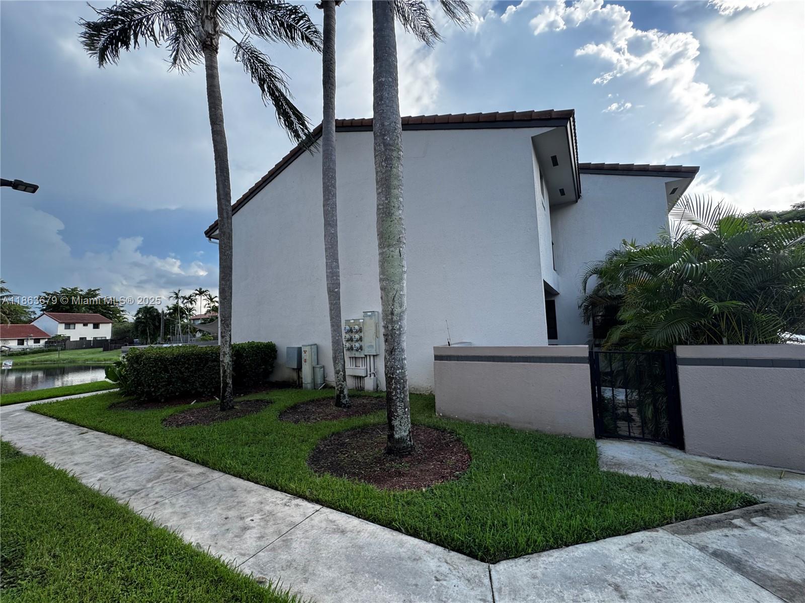 13440 Southwest 62nd Street, Unit G101 Miami, FL 33183 - Photo 21 of 23 a view of a back yard
