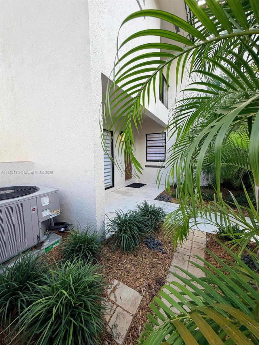 13440 Southwest 62nd Street, Unit G101 Miami, FL 33183 - Photo 23 of 23 a view of a backyard