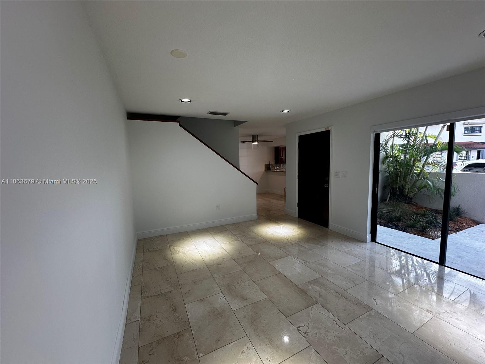 13440 Southwest 62nd Street, Unit G101 Miami, FL 33183 - Photo 5 of 23 a view of a livingroom with a staircase