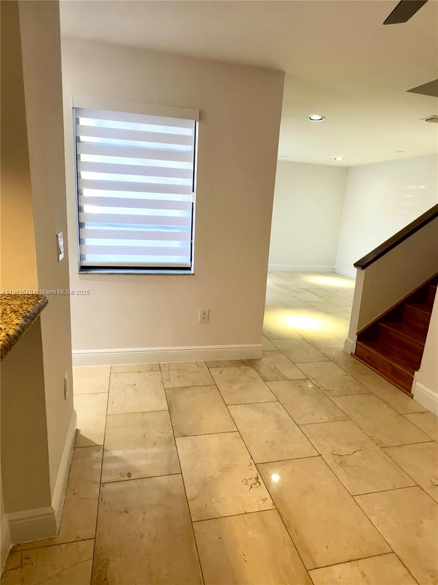 13440 Southwest 62nd Street, Unit G101 Miami, FL 33183 - Photo 10 of 23 a view of an empty room with a window