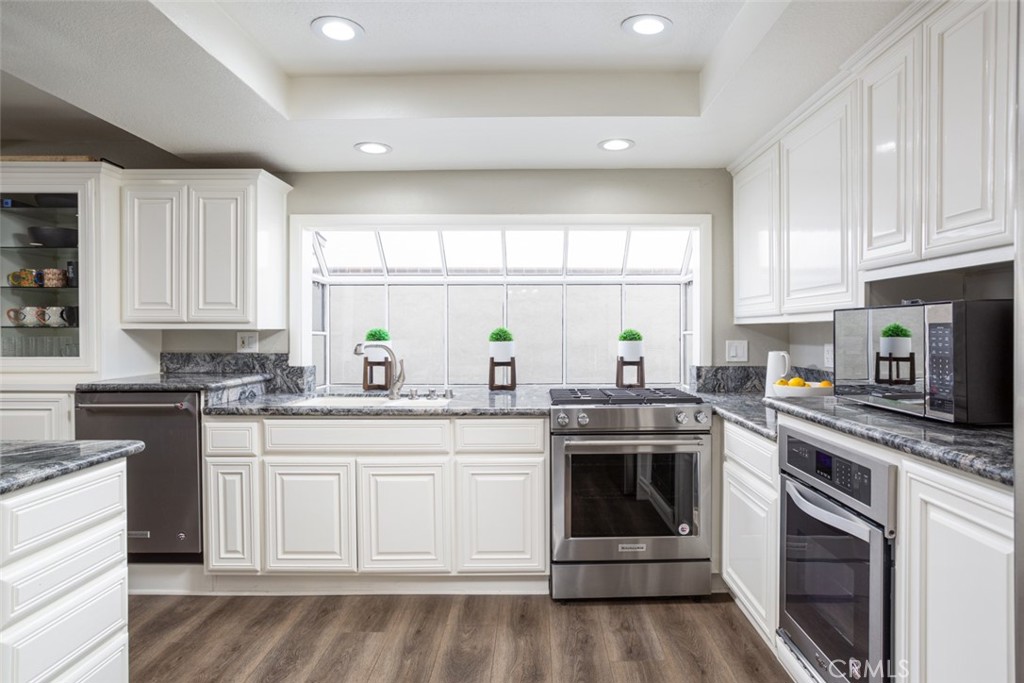 2789 Waxwing Circle Costa Mesa, CA 92626 - Photo 11 of 47 a kitchen with a stove oven and sink