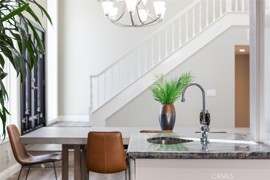 2789 Waxwing Circle Costa Mesa, CA 92626 - Photo 12 of 47 a dining room with table chairs and potted plants