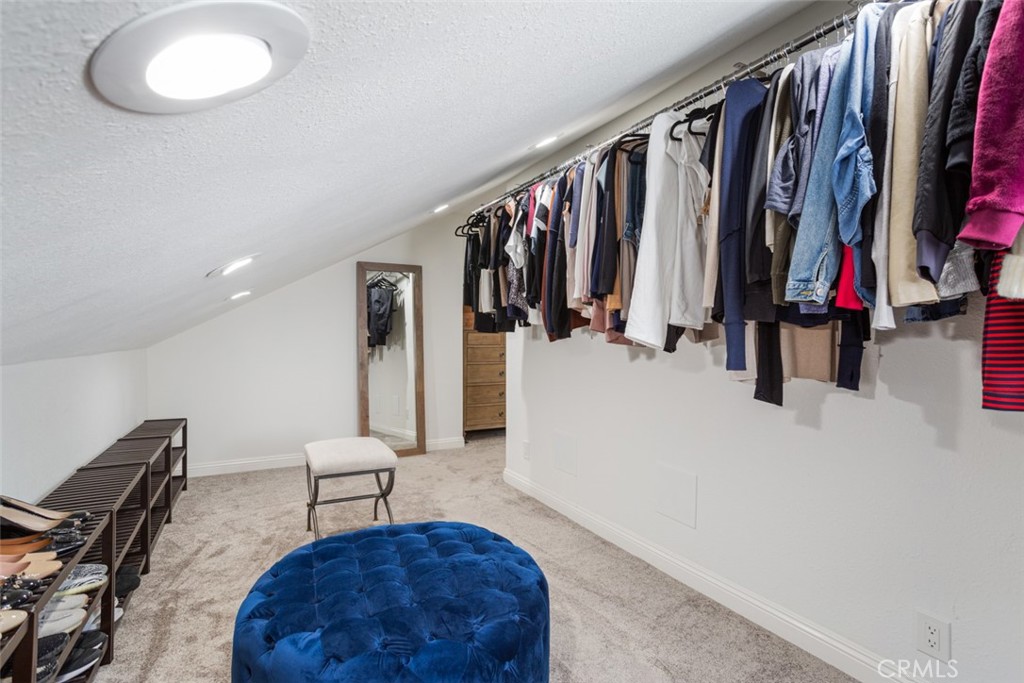 2789 Waxwing Circle Costa Mesa, CA 92626 - Photo 25 of 47 a view of walk in closet with clothes and shoes
