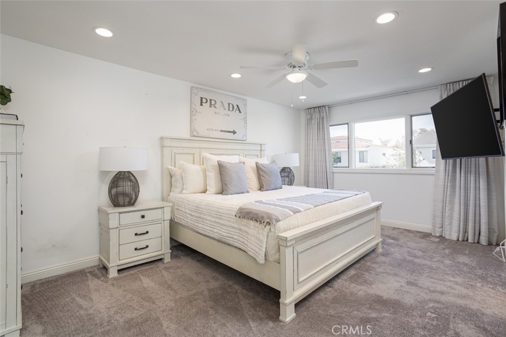 2789 Waxwing Circle Costa Mesa, CA 92626 - Photo 27 of 47 a bedroom with a bed and a flat screen tv