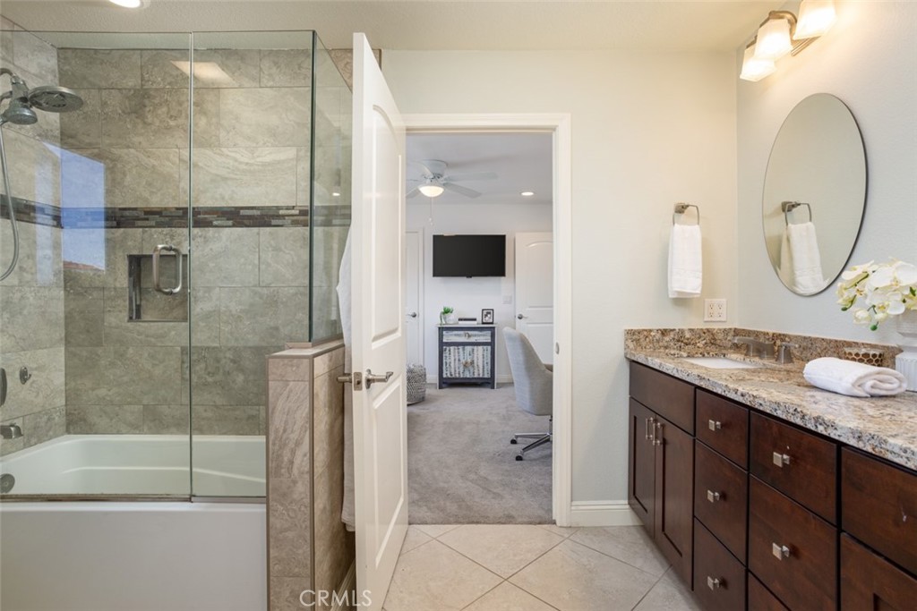 2789 Waxwing Circle Costa Mesa, CA 92626 - Photo 30 of 47 a bathroom with a granite countertop sink mirror and shower