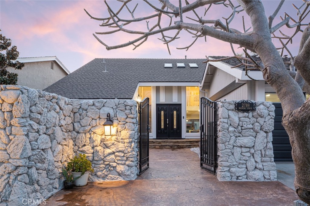 2789 Waxwing Circle Costa Mesa, CA 92626 - Photo 39 of 47 a view of a house with a tree and a yard