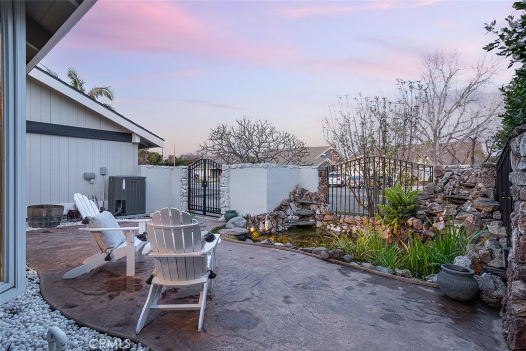 2789 Waxwing Circle Costa Mesa, CA 92626 - Photo 40 of 47 a view of a patio with table and chairs and potted plants