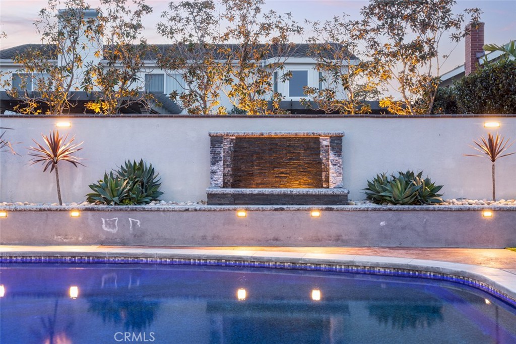 2789 Waxwing Circle Costa Mesa, CA 92626 - Photo 45 of 47 a view of swimming pool with lawn chairs and potted plants