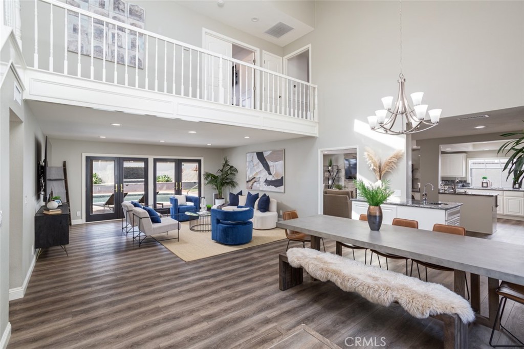 2789 Waxwing Circle Costa Mesa, CA 92626 - Photo 47 of 47 a living room with furniture a chandelier and a dining table