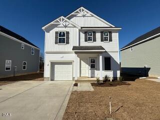 87 Stout Landing Dunn, NC 28334 - Photo 1 of 5 a front view of a house with a yard
