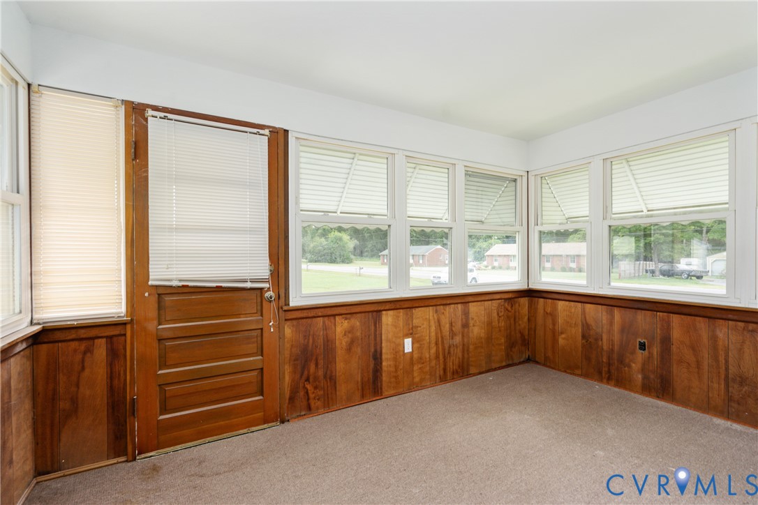 4000 Wayside Road Charles City, VA 23030 - Photo 8 of 30 Room with wood paneling, multiple windows, and a w