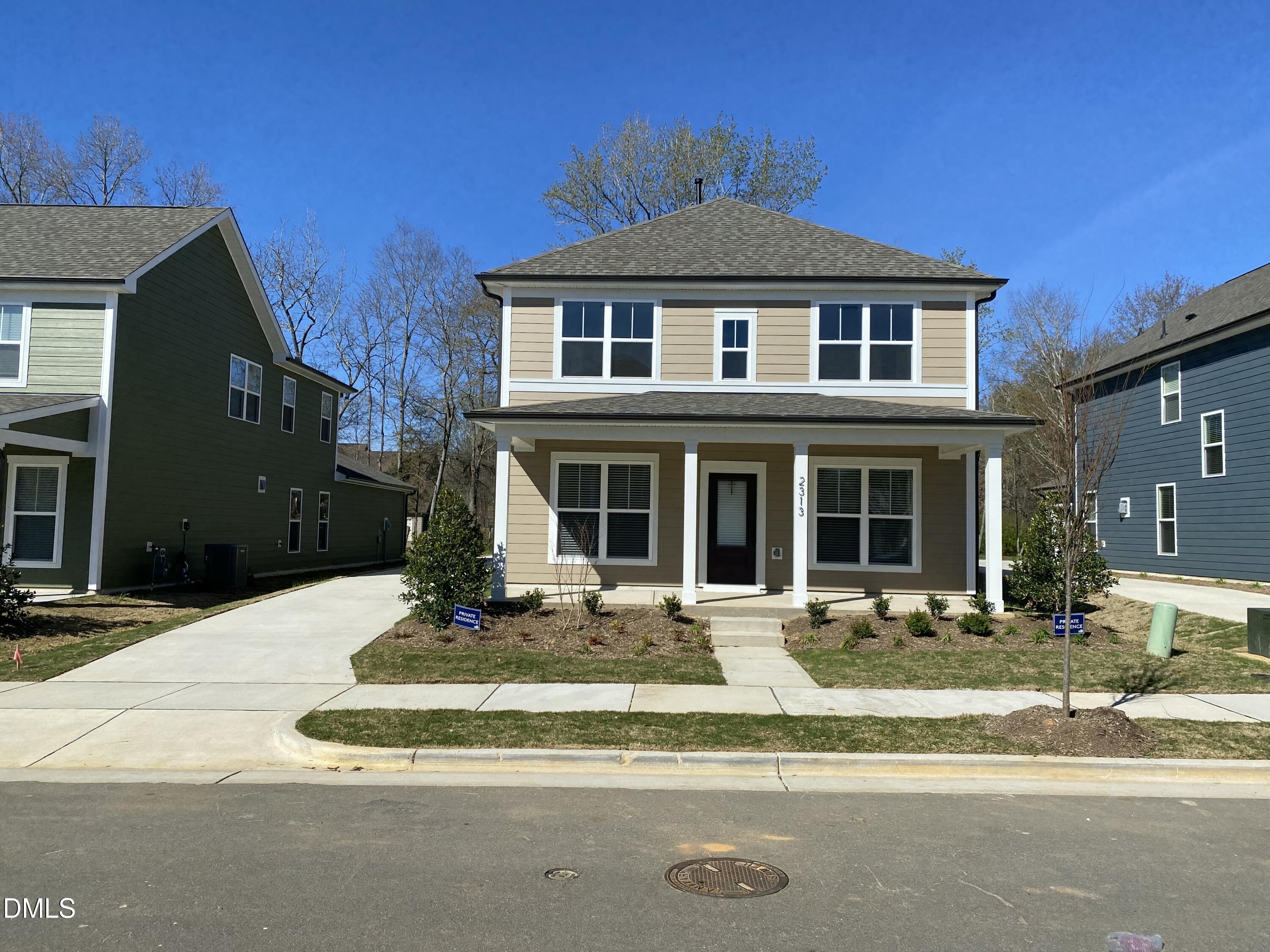 2313 Hedge Maple Drive Raleigh, NC 27603 - Photo 1 of 32 a front view of a house with a yard