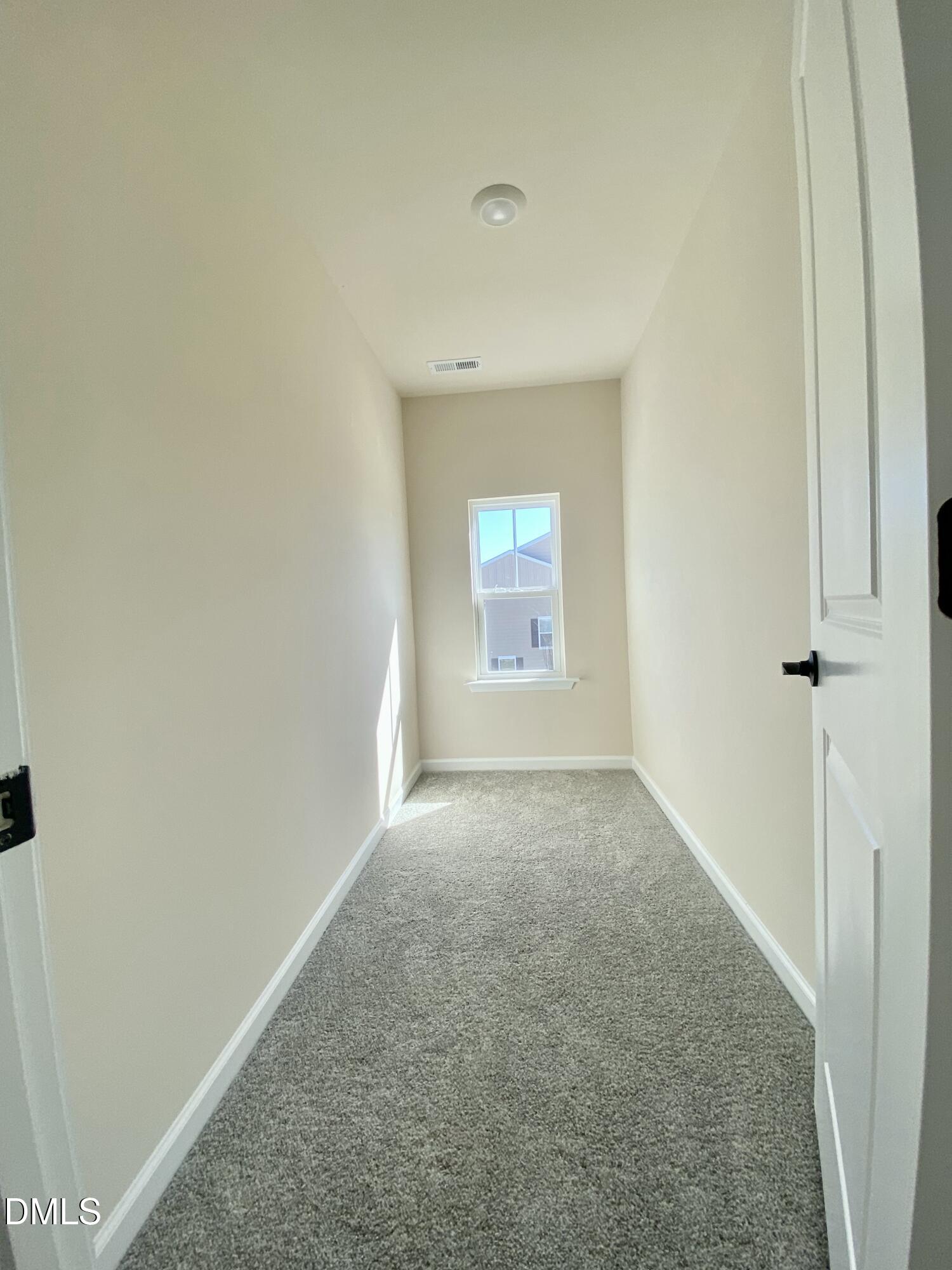 2313 Hedge Maple Drive Raleigh, NC 27603 - Photo 22 of 32 an empty room with a window