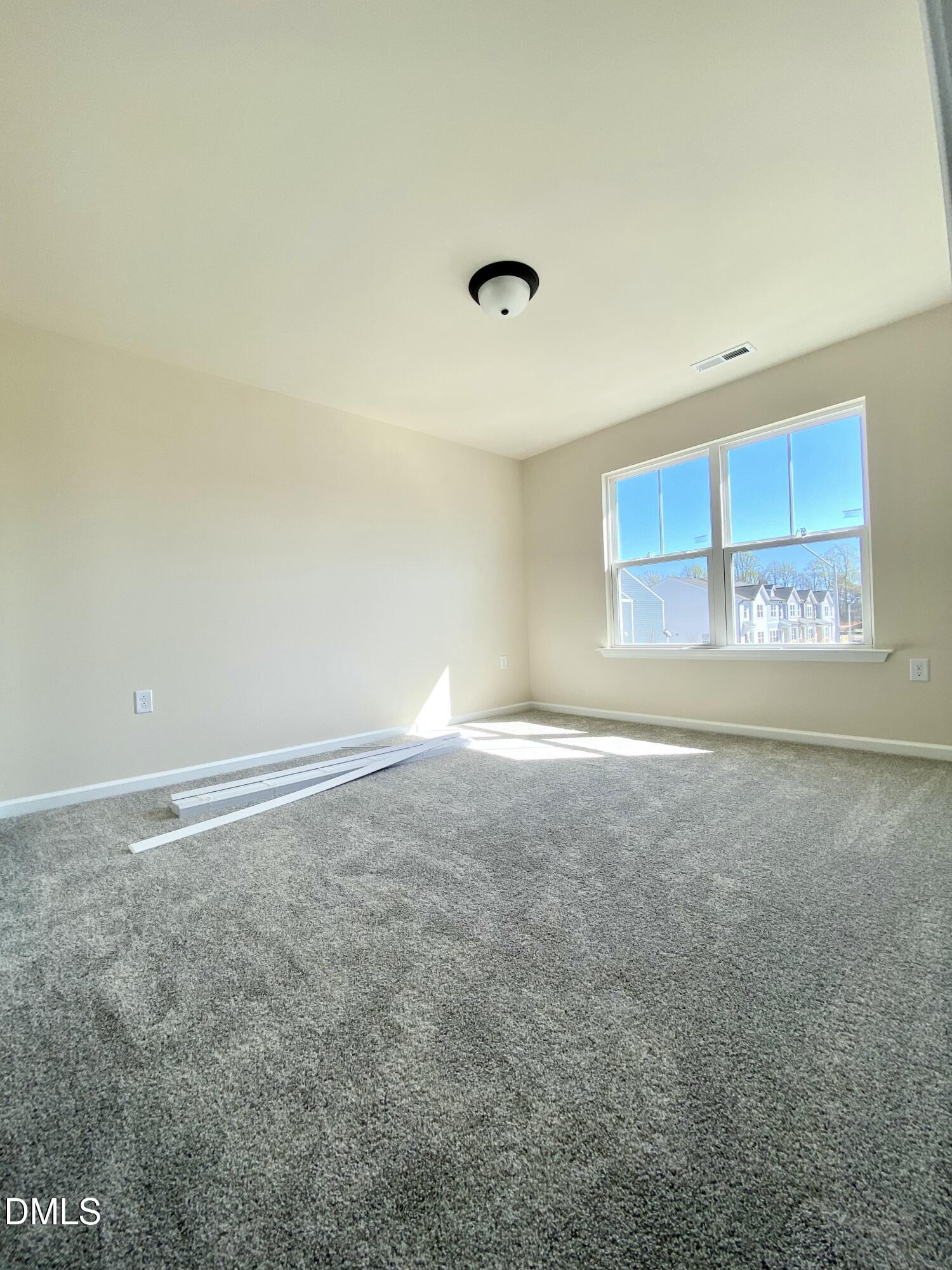 2313 Hedge Maple Drive Raleigh, NC 27603 - Photo 23 of 32 a view of an empty room with a window