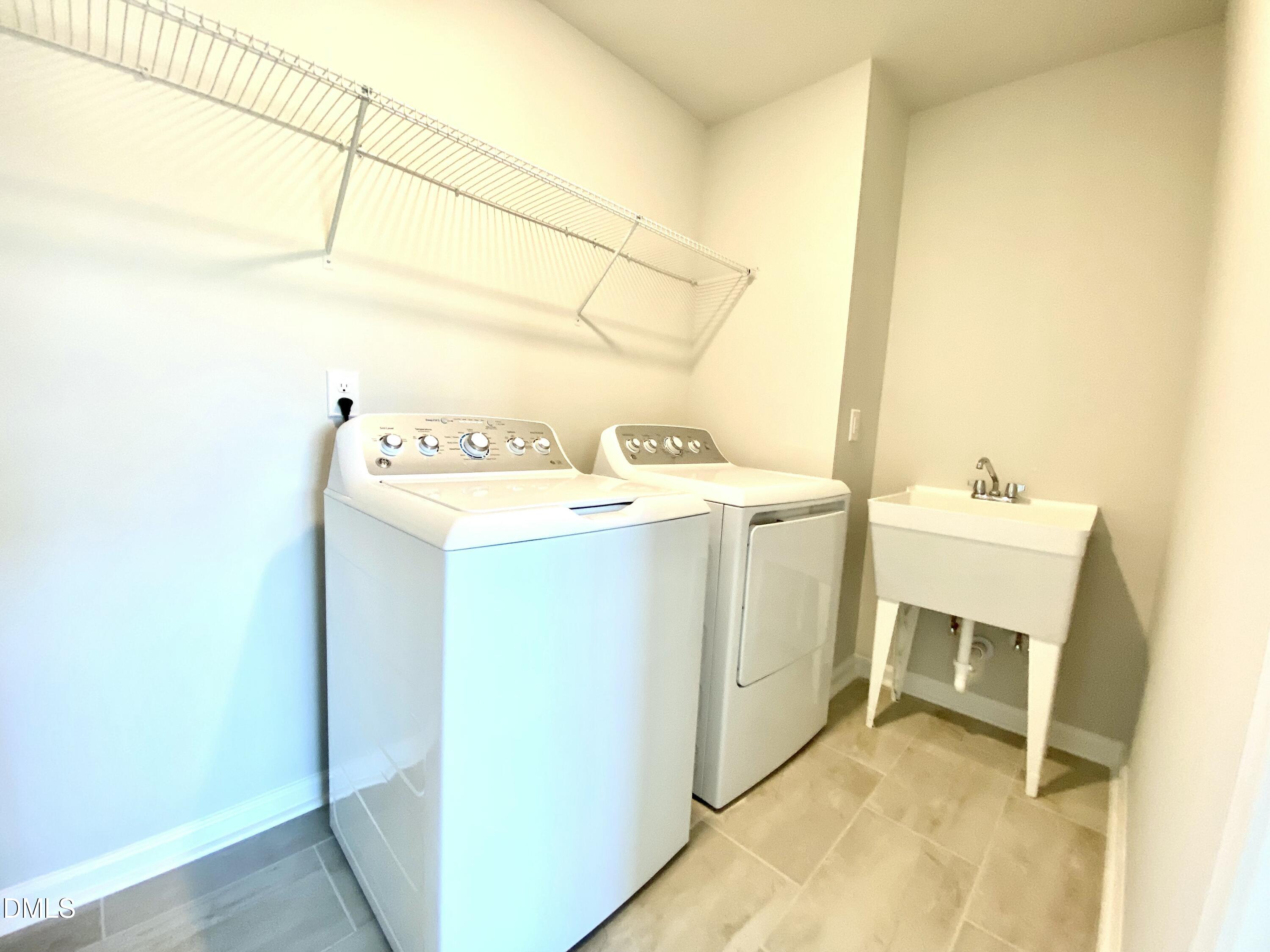 2313 Hedge Maple Drive Raleigh, NC 27603 - Photo 27 of 32 a utility room with dryer and washer