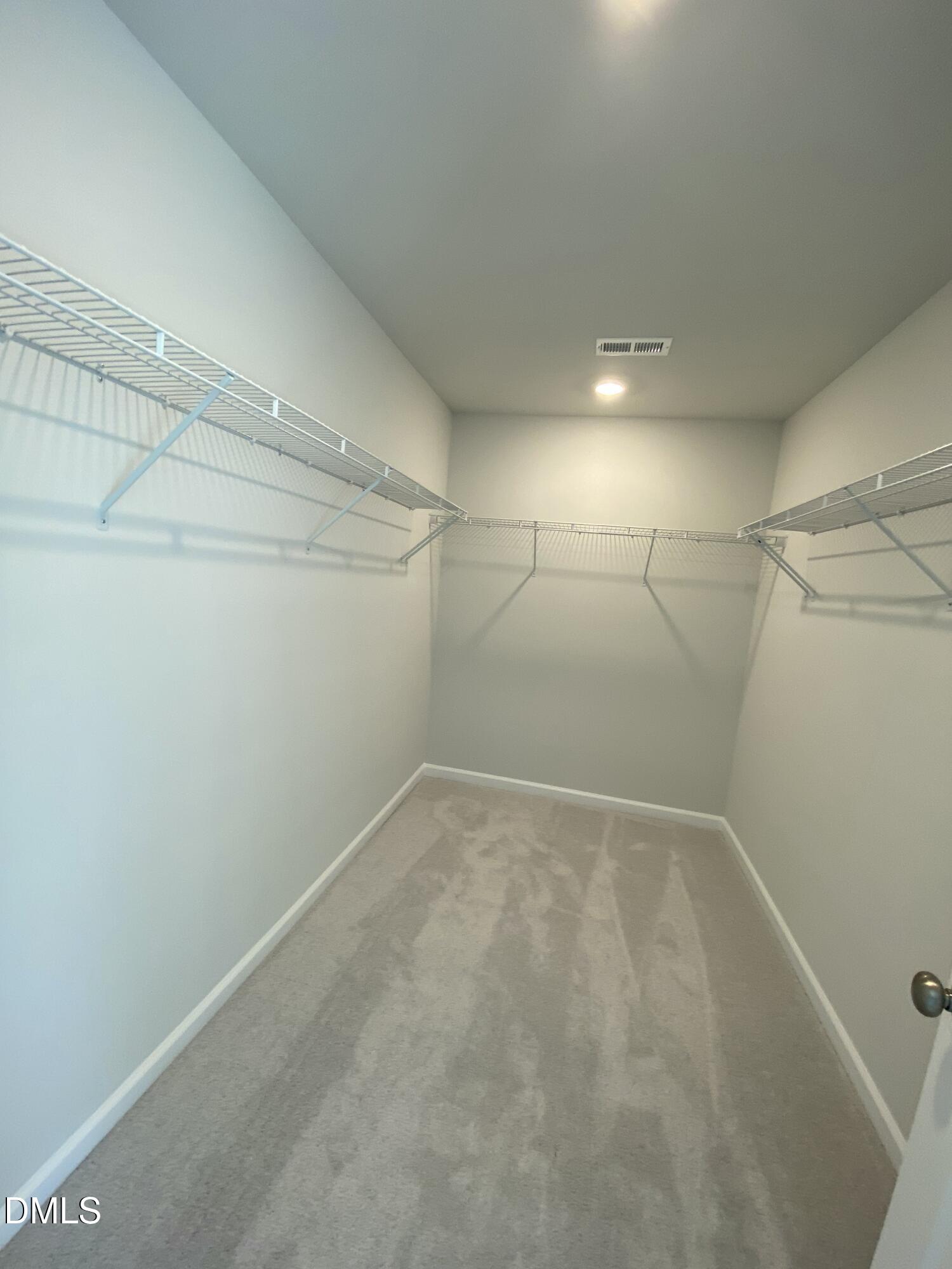 2313 Hedge Maple Drive Raleigh, NC 27603 - Photo 30 of 32 a view of a room with racks on the wall