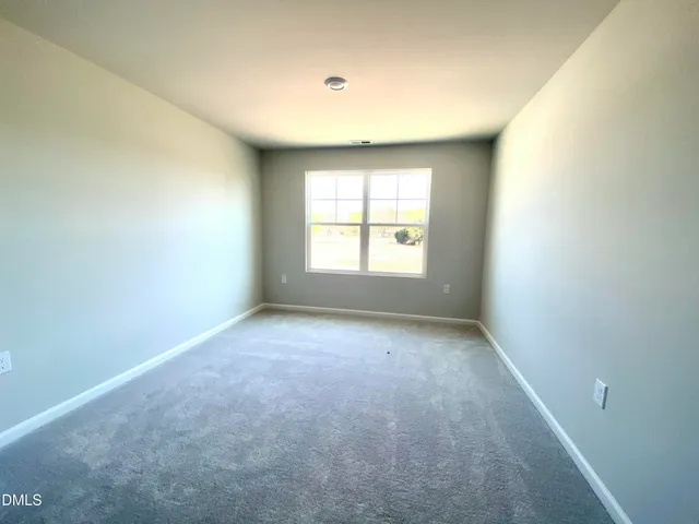 a bathroom with a sink a toilet a large mirror and shower