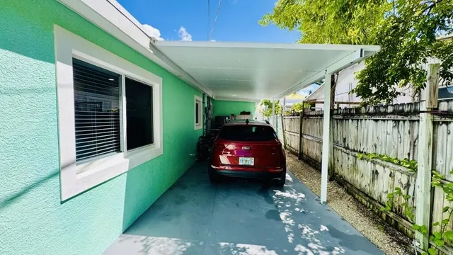 a view of a house next to a yard