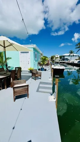 a living room with patio furniture