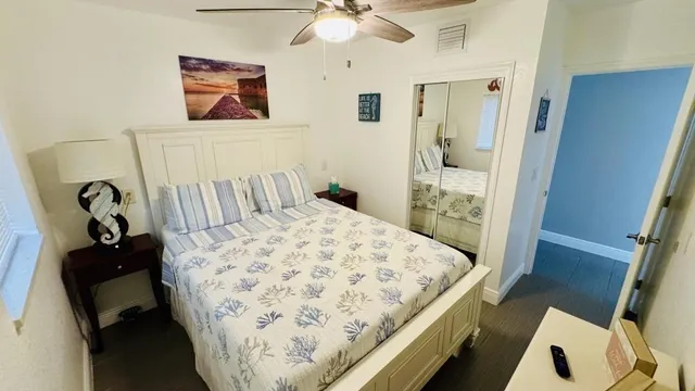 a bedroom with a bed and a dresser