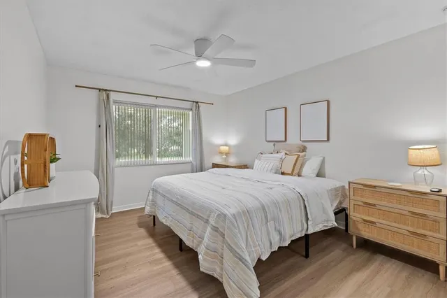 a bedroom with bed and a window