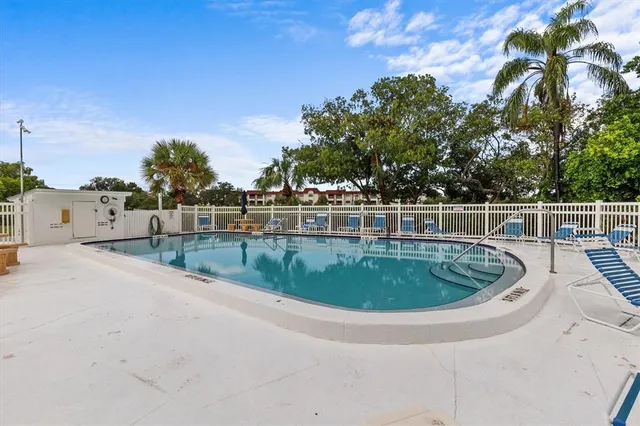 a view of a swimming pool with a yard