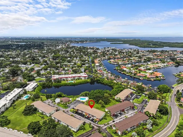 an aerial view of residential houses with outdoor space