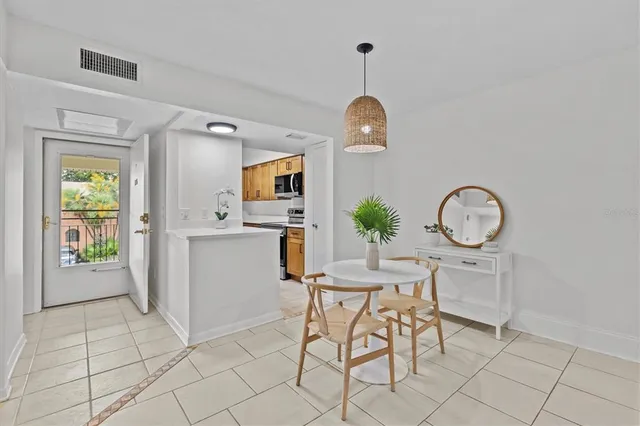 a view of kitchen with furniture wooden floor and window
