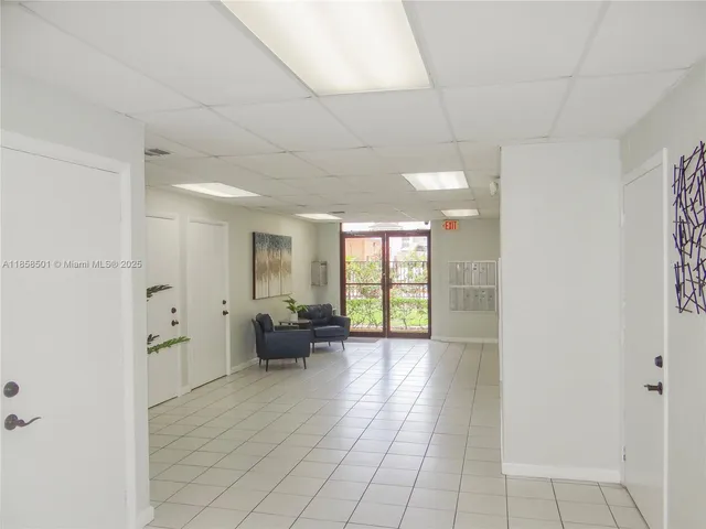 a view of empty room with furniture and wooden floor