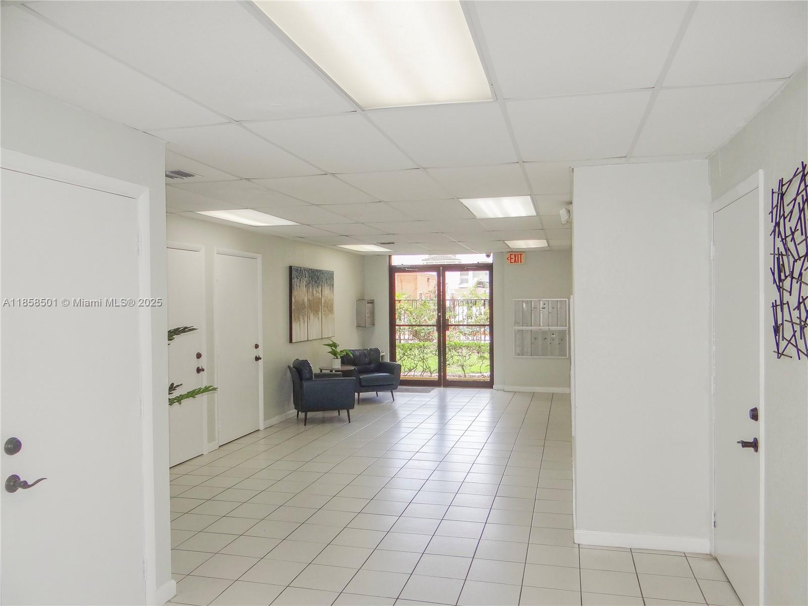 1800 West 54th Street, Unit 309 Hialeah, FL 33012 - Photo 14 of 19 a view of empty room with furniture and wooden floor