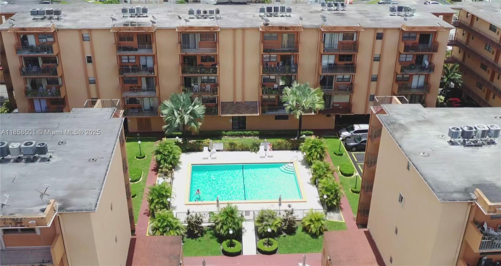 1800 West 54th Street, Unit 309 Hialeah, FL 33012 - Photo 17 of 19 a aerial view of a multi story building