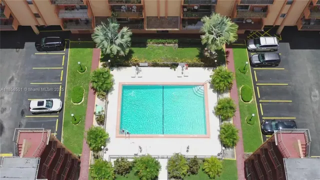 aerial view of a house with street